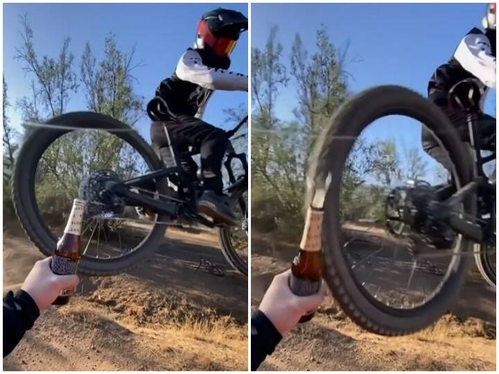 While doing stunts man opened bottle cap from wheel of a mountain bike हवा में कलाबाजी करने के दौरान शख्स ने दिखाई कमाल की ट्रिक, माउंटेन बाइक के पहिए से खोल दी बोतल की कैप
