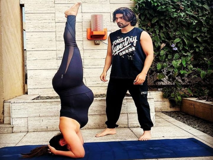 Debina Bonnerjee Nails Headstand In Her 9th Month of Pregnancy photo viral on internet கர்ப்ப காலத்தில் தலைகீழாக யோகா; ஷாக்கான ரசிகர்கள்.. விளக்கமளித்த  சீரியல் ஸ்டார்..