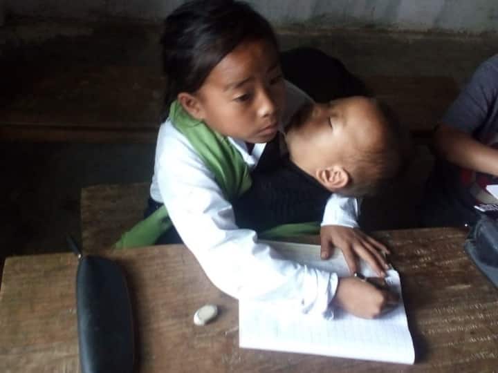 10 year old girl doing class with younger sister in her lap won her heart the minister took this step 1 2775413d3481280356ab07528f2dbd18 original