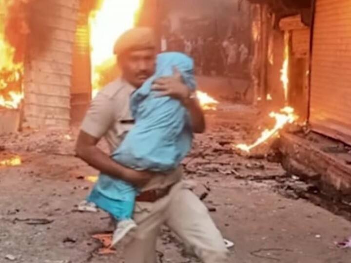 Rajasthan: Cop Runs Through Flames To Save Infant Amid Karauli Violence, IPS Officer Shares Photo Rajasthan: Cop Runs Through Flames To Save Infant Amid Karauli Violence, IPS Officer Shares Photo