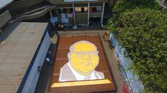 PHOTO : 2 हजार 51 वह्यांनी साकारले 'सिम्बॉल ऑफ नॉलेज', डॉ. बाबासाहेब आंबेडकरांना अनोखी मानवंदना