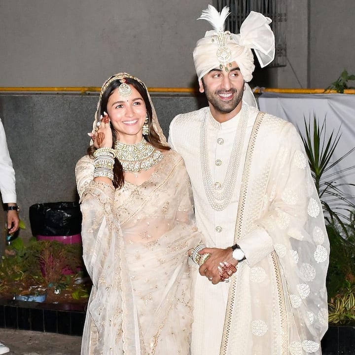 The blushing bride with the happy groom