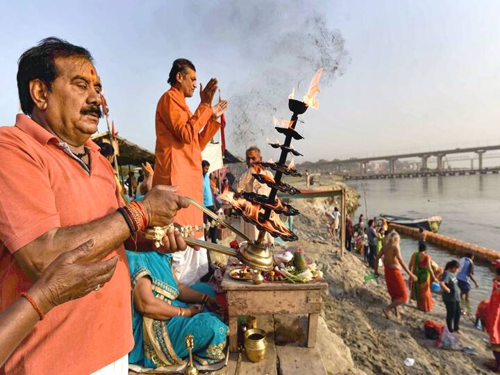Devotees offer prayers on the banks of Ganga river on the occasion of Chaiti Purnima and Lord Hanuman Jayanti festival, at Sangam in Prayagraj, Saturday. (PTI Photo)