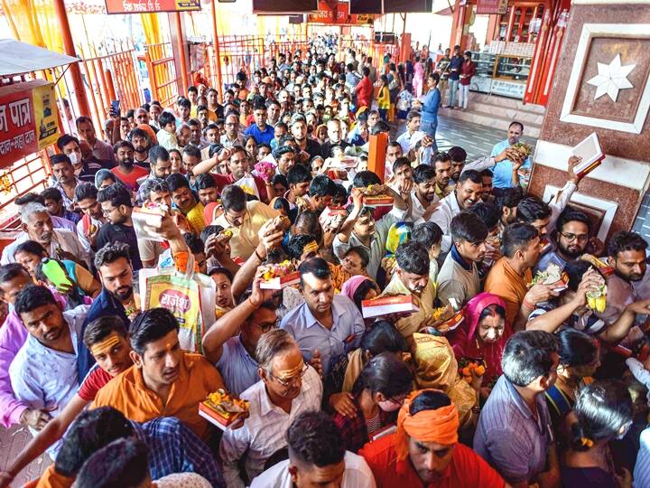 Devotees wait to offer prayers at Bade Hanuman temple on the occasion of Chaiti Purnima and Lord Hanuman Jayanti festival in Prayagraj. (PTI Photo)