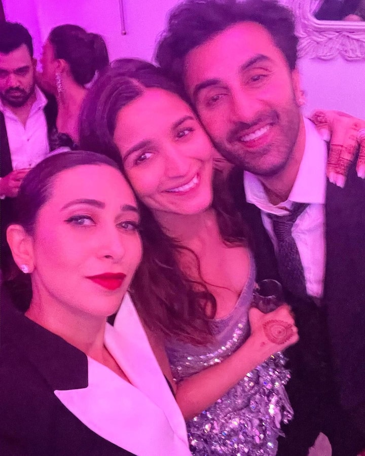 Actress Karisma Kapoor stealing a selfie with Mr and Mrs Kapoor.