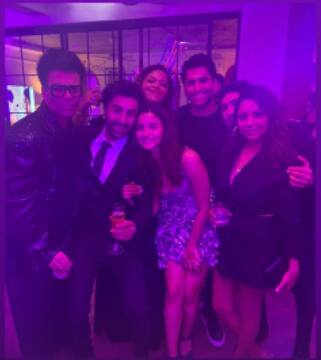 Karan Johar shared a picture with his squad featuring the newlyweds along with Gauri Khan and Ayan Mukerji.