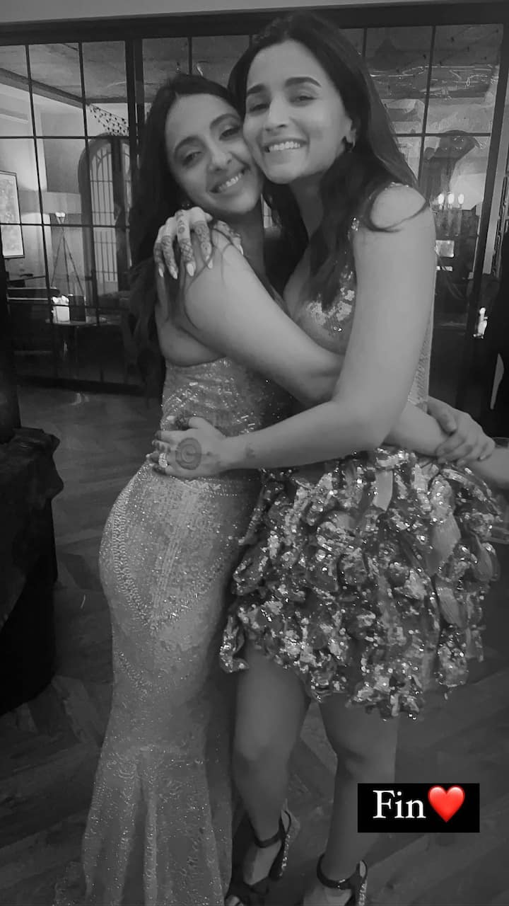 Alia Bhatt getting a bear hug by her BFF Akansha Ranjan Kapoor. The gorgeous Alia shimmered in a silver dress.