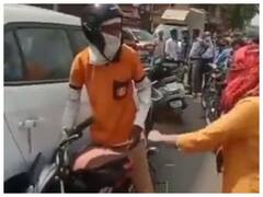 Watch: स्कूटी से टकराई बाइक तो बौखला गई लड़की, बीच सड़क पर फूड डिलीवरी बॉय को जूते से पीटा