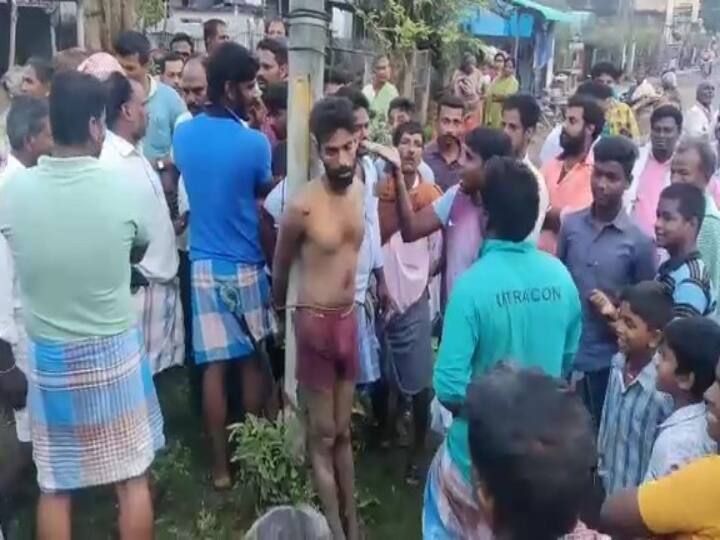 Public beaten a man who tried to rob jewellery in cuddalore பெண்ணிடம் நகை பறிக்க முயன்ற இளைஞரை கம்பத்தில் கட்டி தர்ம அடி கொடுத்த பொதுமக்கள்