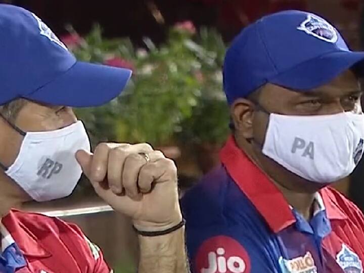 IPL 2022: Delhi support staff wearing masks during PBKS vs DC match goes viral in twitter DC vs PBKS: கொரோனா பாதிப்பு எதிரொலி  மாஸ்க் உடன் இருக்கும் டெல்லி அணியின் பயிற்சியாளர்கள்.. வைரல் படம் !