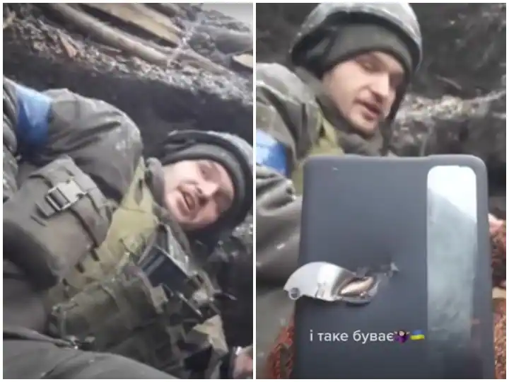 Watch Video: Phone saved Ukrainian soldier life bullet shot stuck in phone Viral Video Watch Video: ਜੇਬ 'ਚ ਰੱਖੇ ਫ਼ੋਨ ਨੇ ਬਚਾਈ ਯੂਕਰੇਨੀ ਫ਼ੌਜੀ ਦੀ ਜਾਨ, ਫ਼ੋਨ 'ਚ ਲੱਗੀ ਗੋਲੀ ਦੀ ਵੀਡੀਓ ਹੋਈ ਵਾਇਰਲ