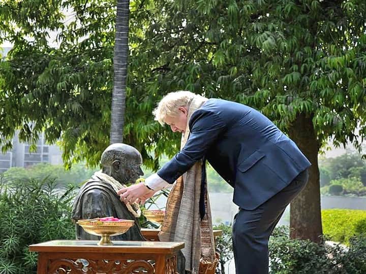 Johnson captured garlanding a statue of Mahatma Gandhi at the Sabarmati Ashram, as his begins his two-day India visit. (PTI Photo)