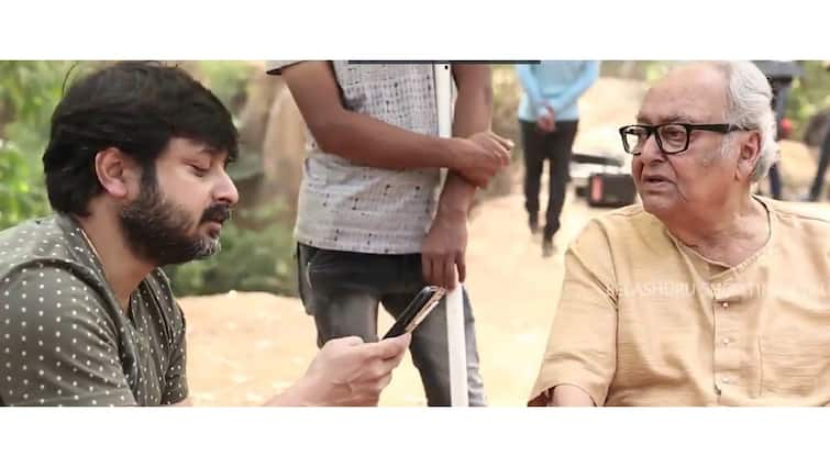 Belashuru:  Windows shares a new video of Sumitra Chatterjee and Shiboproshad Mukherjee from Belashuru Set Belashuru: শ্যুটিংয়ের ফাঁকে ক্রিকেটীয় আড্ডায় মজে সৌমিত্র-শিবপ্রসাদ, 'বেলাশুরু' ক্যামেরার পিছনের গল্প প্রকাশ্যে