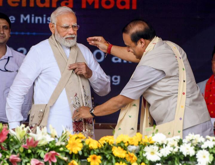 Prime Minister Narendra Modi being felicitated by Assam CM Himanta Biswa Sarma during the ‘unity, peace and development rally’ at Loringthepi in Karbi Anglong district.  (Source: PTI)