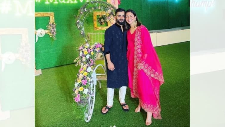 Anushka-Virat pose for a happy picture at fellow player Glenn Maxwell's wedding reception Glenn Maxwell's wedding: ম্যাক্সওয়েলের বিয়ের পার্টিতে ট্র্যাডিশনাল লুকে বিরাট-অনুষ্কা