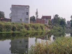 Ambedkar Nagar: तमसा नदी किनारे हुए अतिक्रमण को हटाने की कवायद तेज, लोगों में मची खलबली