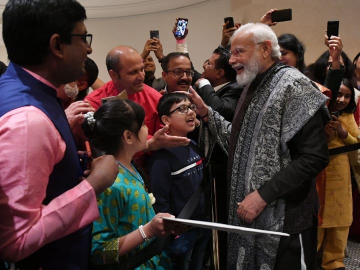 PM Modi Interacts With Indian Community In Germany Berlin, Signed Painting Praises Boy Patriotic Song | PM Modi Berlin Visit: देशभक्ति गीत से लेकर पेंटिंग तक, जर्मनी के बर्लिन में बच्चों से