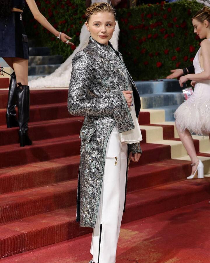 Chloë Grace Moretz rewore the same gorgeous silver coat by Louis Vuitton that she sported at the brand’s Paris Fashion Week 2018-19 show, and fans loved it