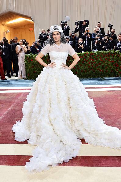 Kylie Jenner turned heads as she arrived to the Met Gala in a bizarre ruffled wedding gown.
