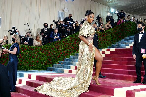 Megan Thee Stallion turned heads in a golden ensemble by Moschino at the 2022 Met Gala.