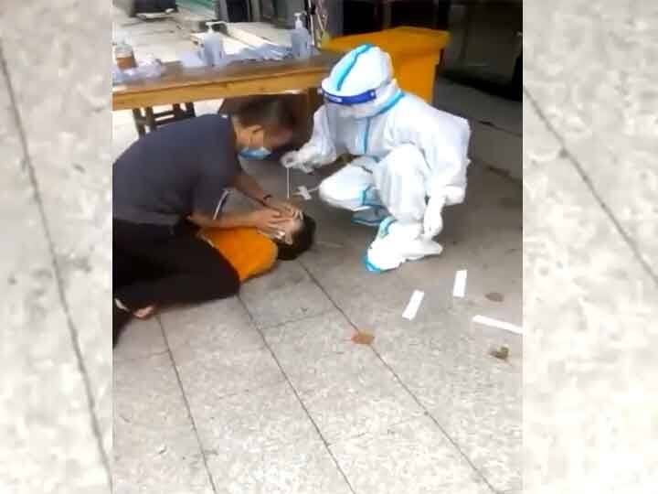 Viral Video Chinese Woman Pinned Down Covid-19 Test Done Forcibly Viral Video: ఇదేం కొవిడ్ టెస్ట్‌ రా నాయనా! కింద పడేసి, మీద కూర్చొని!