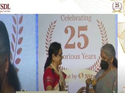 Watch: Nirmala Sitharaman gets up from her seat, offers water to NSDL MD Watch Video: நிகழ்ச்சியில் தண்ணீர் கேட்ட அதிகாரி ஓடிச் சென்று உதவிய அமைச்சர் நிர்மலா சீதாராமன்.. குவியும் பாராட்டு!