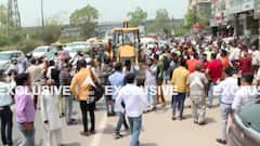 Delhi: Shaheen Bagh में Bulldozer के आगे बैठे Congress कार्यकर्ता, BJP पर लगाया साजिश का आरोप