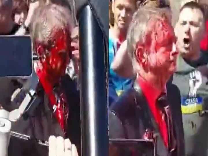 Russian Ambassador Throws Red Color At Victory Day Celebrations In Poland VIDEO: पोलैंड में विजय दिवस समारोह में रूसी राजदूत का विरोध, लाल रंग फेंका गया