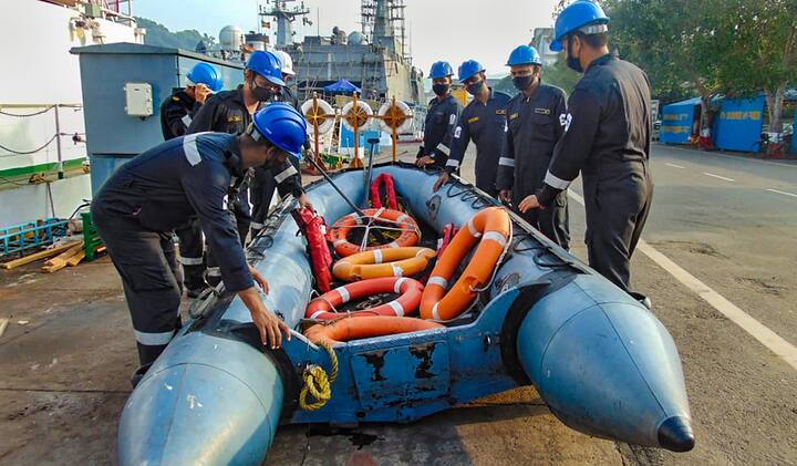 Members of the Coast Guard Disaster Relief Teams (DRTs) prepare an inflatable boat and floatation devices as part of precautionary measures against the severe cyclonic storm. Heavy rains lashed Chennai and its suburbs on Tuesday. Ten flights from the Chennai airport were cancelled, including to from Jaipur, Visakhapatnam, Mumbai and Hyderabad, due to the heavy downpour. (Image: PTI)