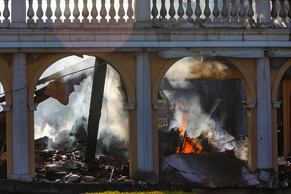 A home still smoldering from the Coastal fire on Coronado Pointe in Laguna Niguel, CA. (Source: Getty Images)