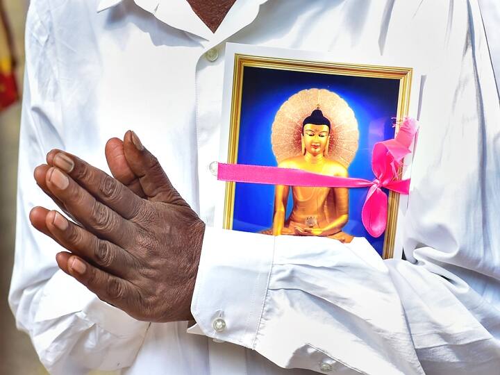 Today the followers of Lord Buddha across the world are celebrating the 2584th birth anniversary of Gautama Buddha, the founder of Buddhism. In photo, a Buddhist devotee offers prayers on the occasion of Buddha Purnima, at Mahabodhi Society in Bengaluru, Monday, May 16, 2022. (PTI Photo/Shailendra Bhojak)