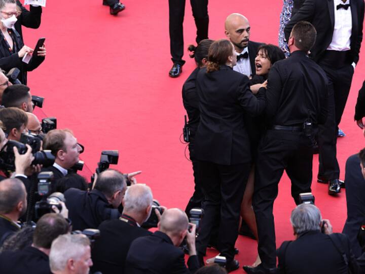Woman Strips On Cannes Red Carpet To Protest Sexual Violence In Ukraine By Russian Troops 'Stop Raping Us': Woman Strips On Cannes Red Carpet To Protest Sexual Violence In Ukraine By Russian Troops