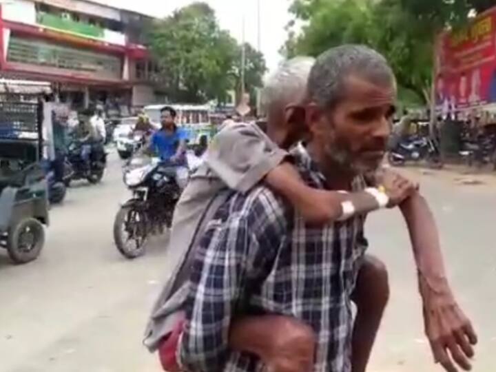 Gonda District Hospital Uttar Pradesh Son carrying father on back from dengue ward lack of  treatment ANN Gonda: अस्पताल में इलाज ना मिलने से तड़पता रहा मरीज, बुजुर्ग को 20 किलोमीटर पीठ पर लादकर चला बेटा