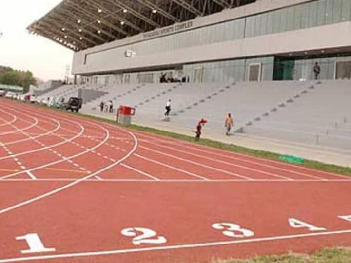 delhi IAS officer Sanjeev Khirwar who walked dog in stadium transferred wife Rinku Dugga also sent to arunachal Marathi News स्टेडियममध्ये कुत्रा फिरवण्यासाठी खेळाडूंना बाहेर काढणं महागात; IAS अधिकाऱ्याची तत्काळ बदली