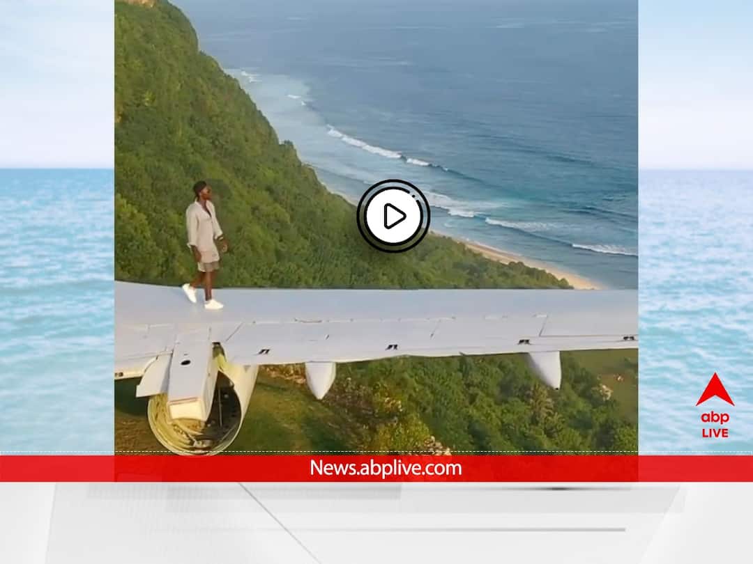 viral video Man walks On Wing of Boeing Aircraft On Bali Seaside Cliff WATCH VIDEO | Man Walking On Aircraft Wing On Bali Seaside Cliff Will Take Your Breath Away