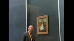 Mona Lisa: কখনও পাথর, কখনও আবার অ্য়াসিড, এ বার মোনালিসার মুখে লেপা হল কেক, দেখুন ছবি