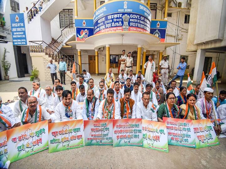 Bihar Congress President Madan Mohan Jha with party leaders participate in a protest, during summoning of Congress leader Rahul Gandhi in the National Herald case, in Patna, Monday, June 13, 2022. (PTI Photo)