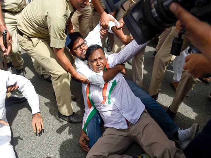 Congress leader Udit Raj and activists being detained during a protest against summoning of party leader Rahul Gandhi in the National Herald case, near ED office in New Delhi, Monday, June 13, 2022. (PTI Photo/Atul Yadav)