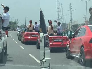 groom fined 2 lakhs for dancing and taking selfies in audi open roof ஆடி காரில் ஆடியபடி சென்ற மணமகன்...  திருமண நாளில் 2 லட்சம் அபராதம்!