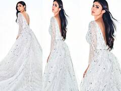 Mouni Roy Pics: व्हाइट बैकलेस गाउन में मौनी रॉय का दिखा किलर लुक, खुले बालों में गिरा रही हैं फैंस पर बिजलियां