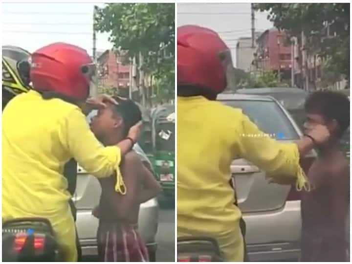 A woman was seen helping a child at a traffic signal Viral Video Watch: ट्रैफिक सिग्नल पर बच्चे की मदद करती नजर आई महिला, दिल जीत रहा ये वायरल वीडियो