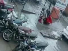 WATCH | Cop, Wife Almost Drown As Scooter Falls Into Drain On Waterlogged Road In Aligarh