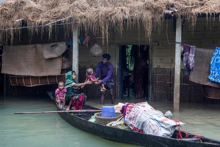 Schools have been turned into relief shelters to house entire villages. Flooding forced Bangladesh's third largest international airport in Sylhet to shut down last week. (Image Source: AFP)
