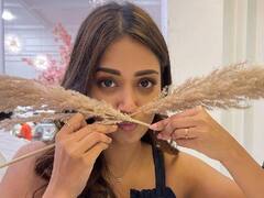 Actress Nivetha Pethuraj: ஊதா பூவில் ஊற்றிய வண்ணம்..நடிகை நிவேதா பெத்துராஜின் ஜாலி போட்டோஸ்