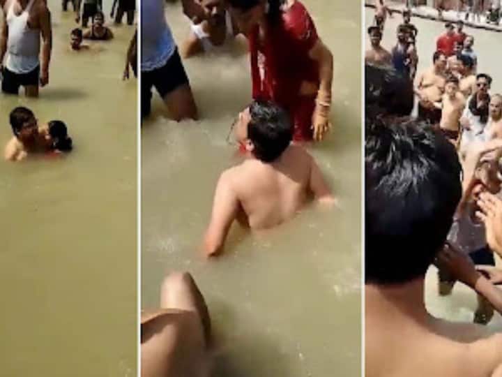 Ayodhya: Angry Mob Thrashes Man For 'Kissing His Wife' While Bathing In Saryu River — WATCH Ayodhya: Angry Mob Thrashes Man For 'Kissing His Wife' While Bathing In Saryu River — WATCH