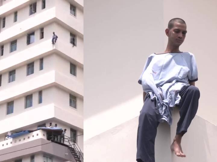 மருத்துவமனையின் 7வது மாடியில் இருந்த குதித்த நோயாளி.. பதறவைக்கும் காட்சிகள்...! A patient has climbed out of a ward to sit on a highrise edge மருத்துவமனையின் 7வது மாடியில் இருந்த குதித்த நோயாளி.. பதறவைக்கும் காட்சிகள்...!