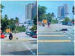 Watch: ट्रैफिक नियमों का पालन करने के बाद भी महिला हुई हादसे का शिकार, आसमान से बरसी आफत