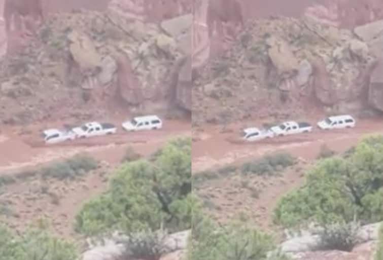 Hikers Watch On As Pickup Trucks Hit By Flash Flooding At National Park In Utah