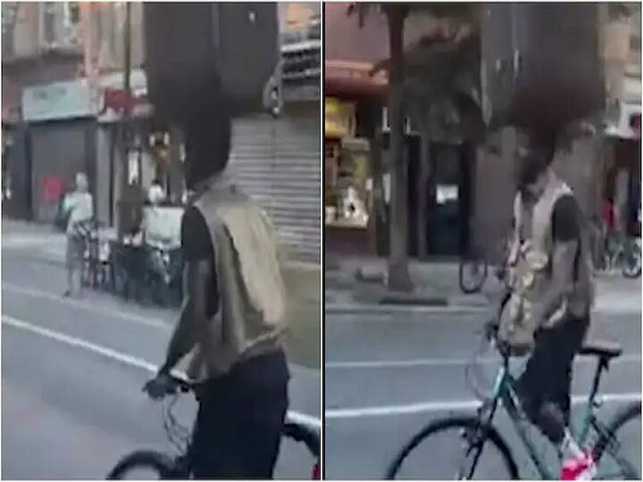 USA: Video of man cycling and balancing  suitcase on head goes viral in social media Watch Video: இது சூட்கேஸ் கரகாட்டம்! பெரிய பெட்டியை தலையில் வைத்துக்கொண்டு அசால்டாக சைக்கிள் ஓட்டும் நபர்!