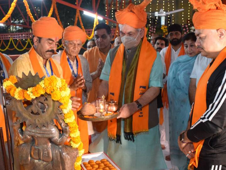 Jammu and Kashmir Lt Governor Manoj Sinha conducts a puja at the Bhagwati Nagar base camp before flagging off the first batch of pilgrims for the Amarnath Yatra 2022. (PTI Photo)